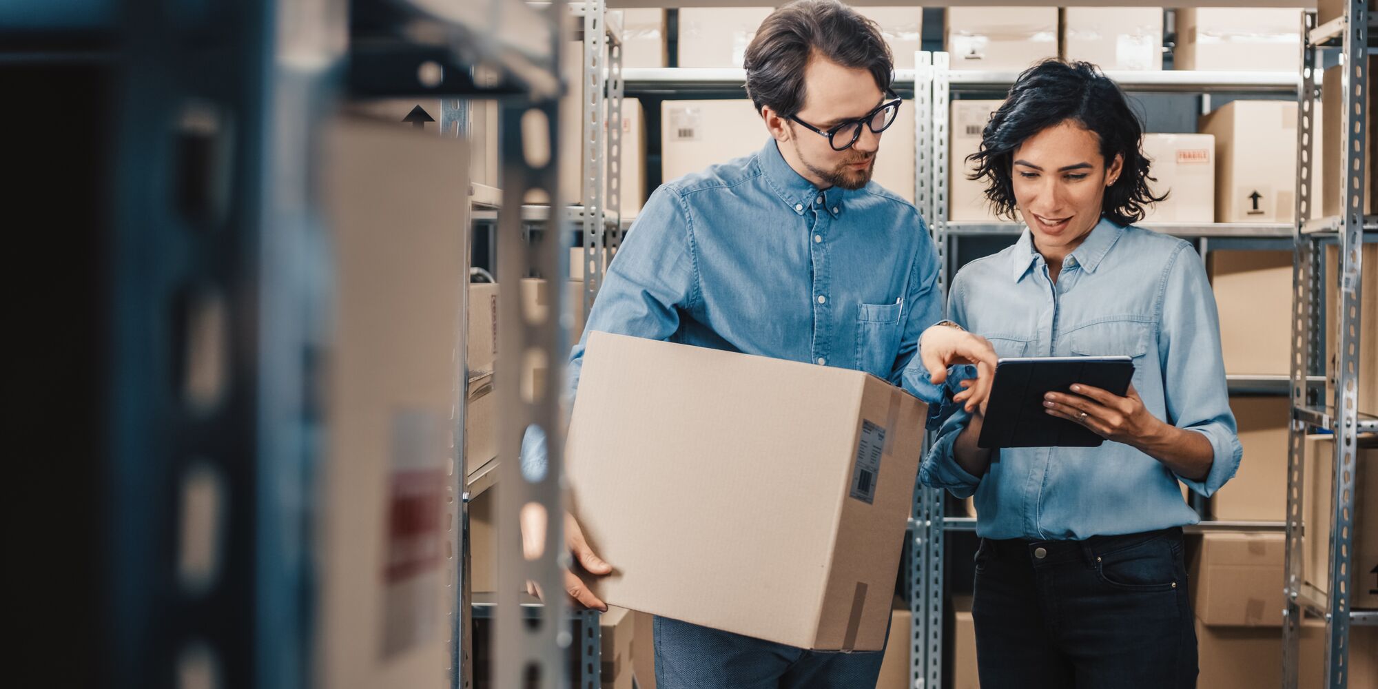 Female inventory manager with worker 