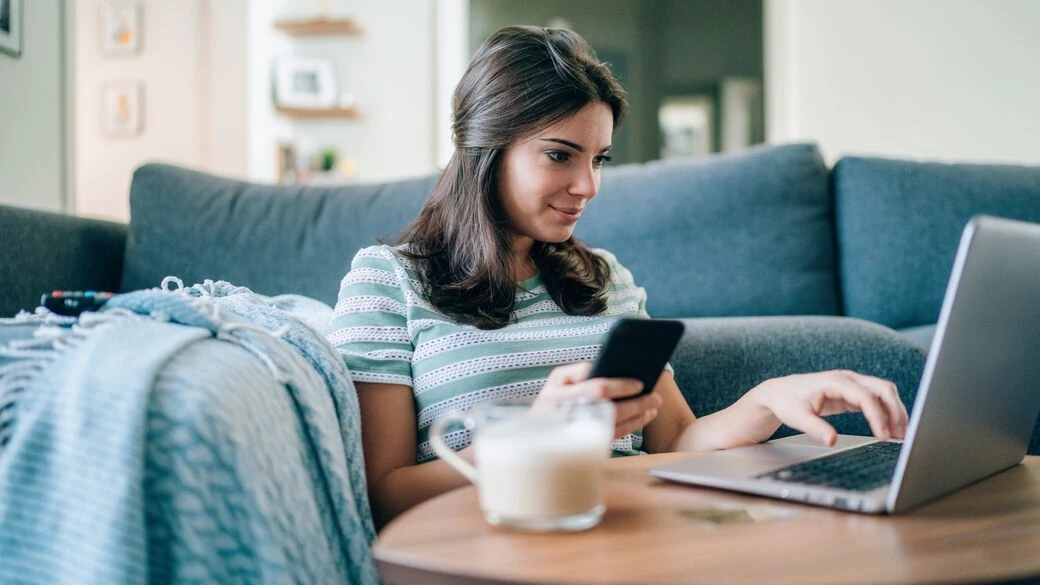 Young woman surfing the internet at home